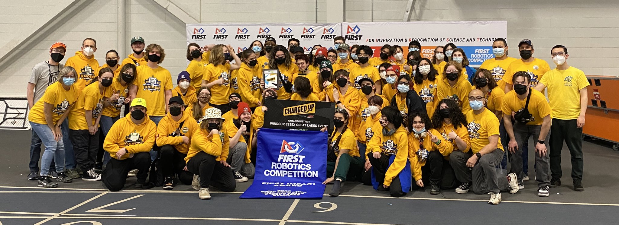 Photo of Raider Robotic's team in 2023 having won the FIRST Impact Award