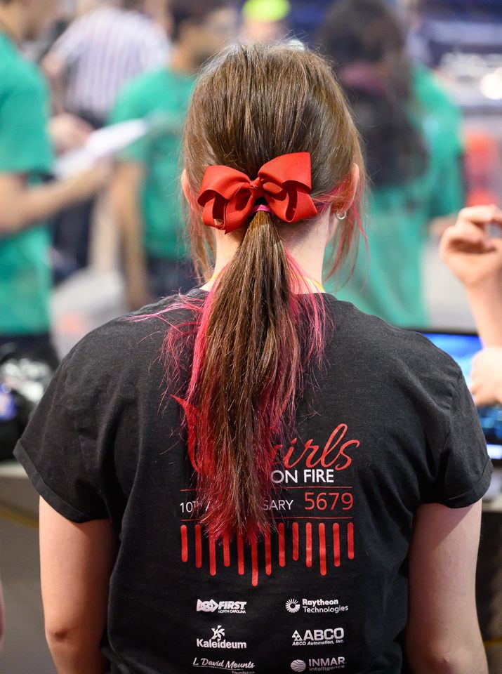 Photo of one of the Girls on Fire members showing their red bow and hair colour